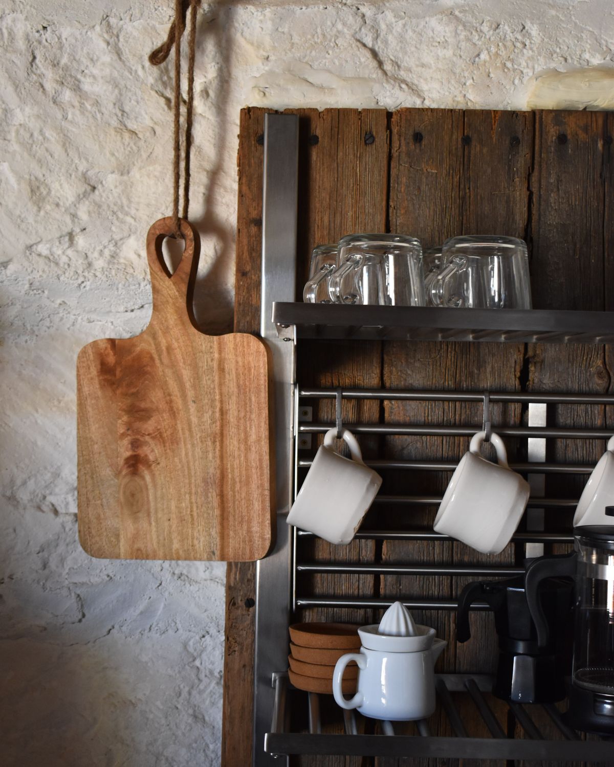 Illustrative kitchen rack with mugs, glassware and serving accessories